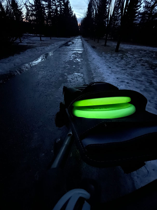 Glow discs in a bag on a local course